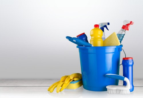 Office cleaning team sanitizing desks and shared surfaces